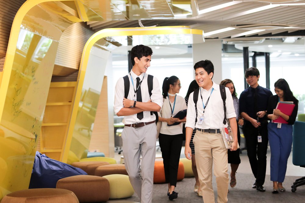 group of students walking and laughing