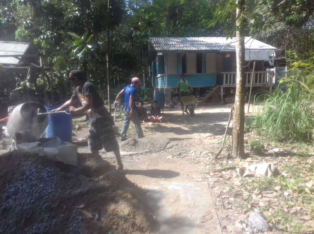 Orang asli community building cement mixer